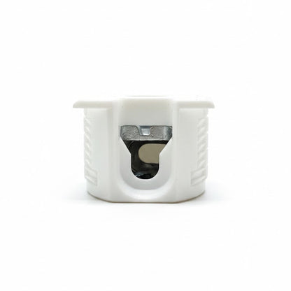 White plastic component with a central hole on a white background