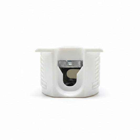 White plastic component with a central hole on a white background